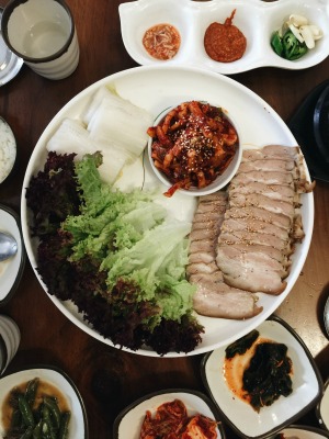korean style of wrapped meat- softly boiled pork, cabbage slices and kimchi, spicy pickled vegetable