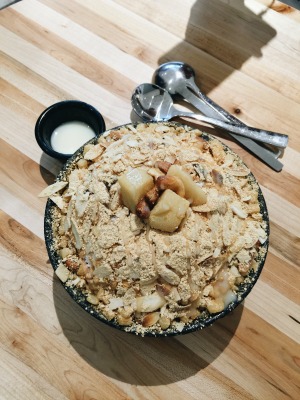 a picture of bingsu topped with roasted sesame seed powder
